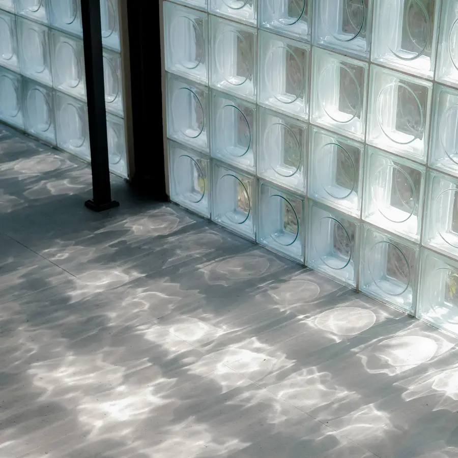 Daylight through the glass-block wall on the studio floor