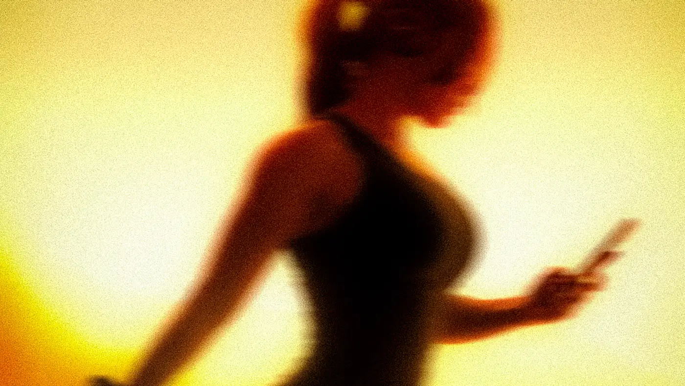 A member stretching in the warm light of ASAI GYM