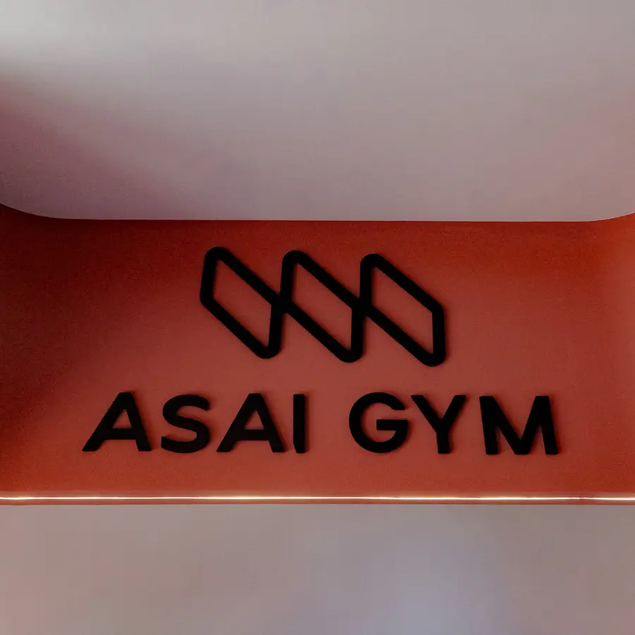 The ASAI GYM sign on a terracotta wall